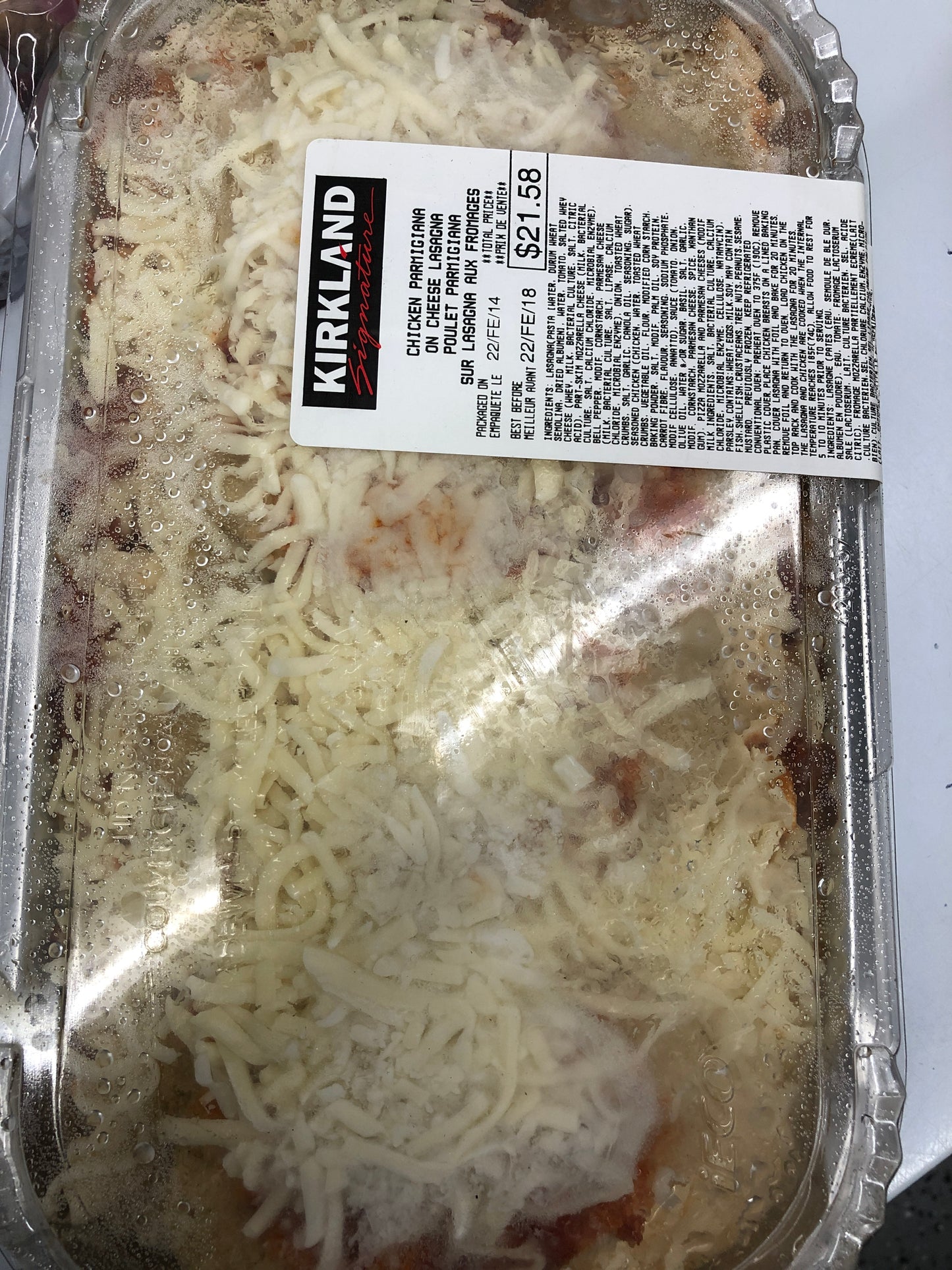 Chicken parmigiana on cheese lasagna